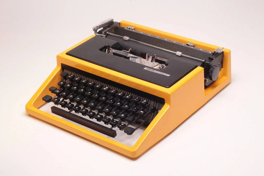 SOLD! Olivetti Dora Yellow, Vintage Manual Typewriter, Refurbished - ElGranero Typewriter.Company