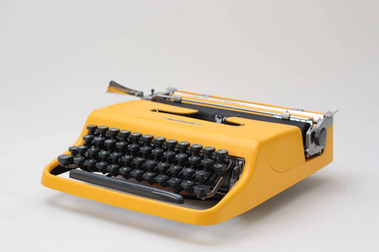 Olivetti Pluma 22 Yellow, Vintage Manual Typewriter, Refurbished - ElGranero Typewriter.Company