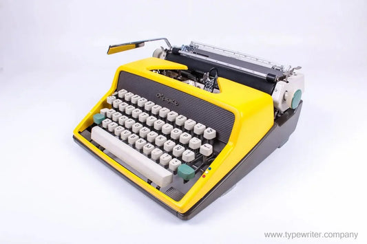 SOLD! Olympia SM 7 / 9 Black & Yellow, Manual Typewriter, Refurbished - ElGranero Typewriter.Company