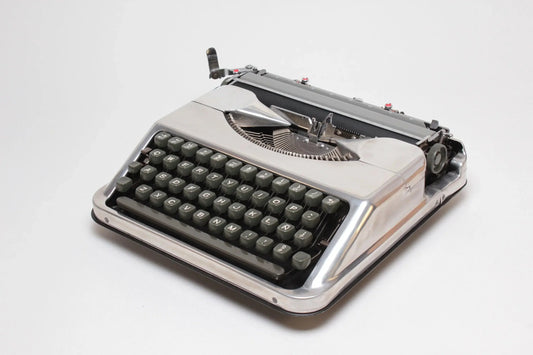 Hermes Baby Polished Silver Portable Vintage Manual Typewriter, Refurbished - ElGranero Typewriter.Company