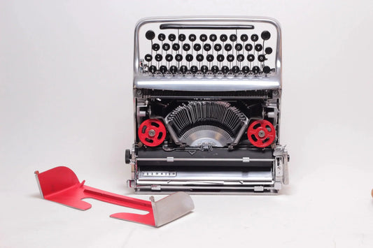 Olivetti Pluma 22, Polished Silver Manual Vintage Typewriter, Restored - ElGranero Typewriter.Company