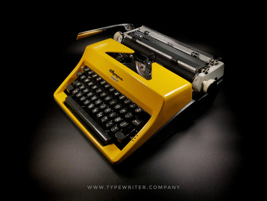 Olympia SM Glossy Yellow Vintage Manual Portable Typewriter, Refurbished - ElGranero Typewriter.Company