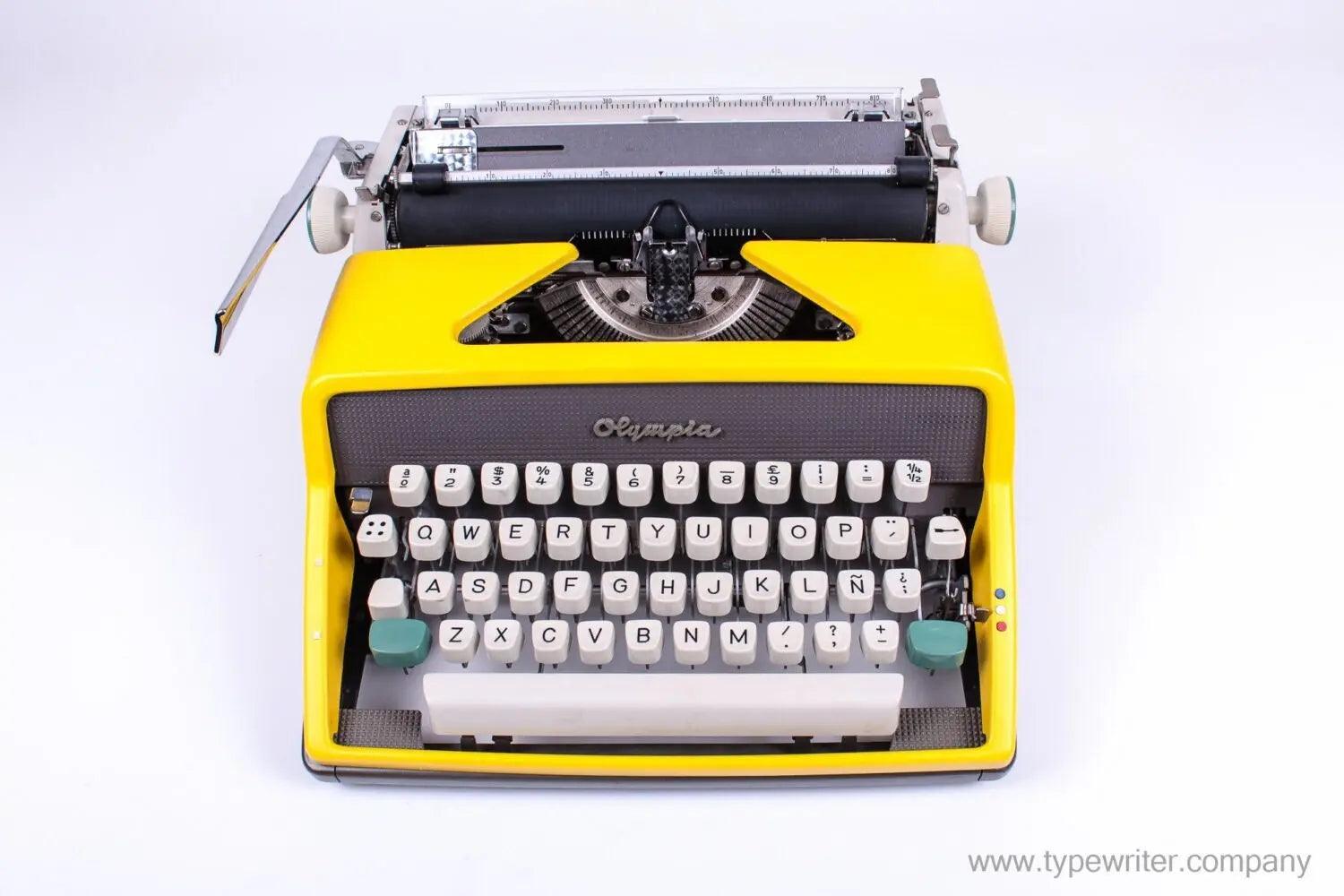 SOLD! Olympia SM 7 / 9 Black & Yellow, Manual Typewriter, Refurbished - ElGranero Typewriter.Company